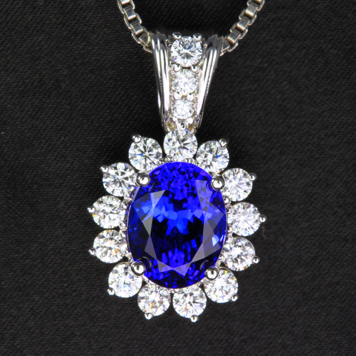 14k White Gold Tanzanite and Diamond Halo Pendant 6.17 Carats designed by Christopher Michael